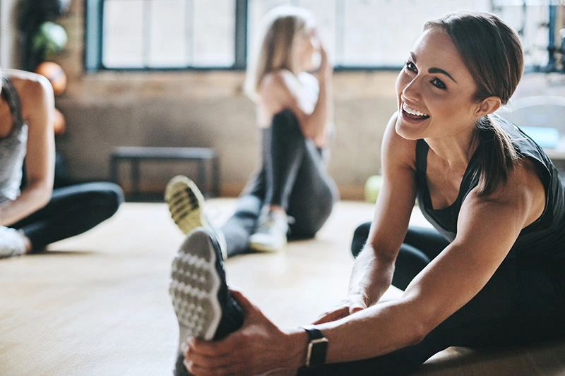 People participate in an exercise class, part of a healthy sober routine.